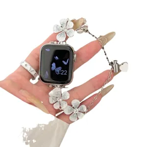 Metall Blumen Uhrenarmband fuer Apple Watch, elegantes Silberketten Design mit Anhaengern.