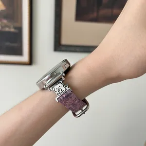 Replacement watch strap with purple tie-dye fabric design and cute metal animal connector.