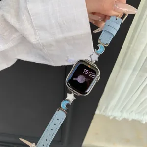 Blue leather watch strap with cute stars and moon charms compatible with Apple Watch.