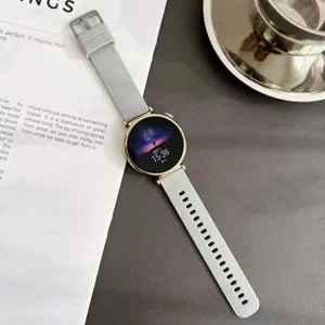 Bracelet de montre connectée en silicone gris de rechange avec boucle en métal et cadran.
