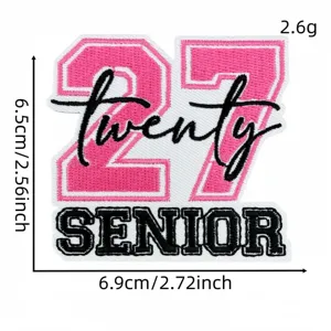Detailed view of 2027 graduation embroidered patch pink number twenty senior apparel DIY.