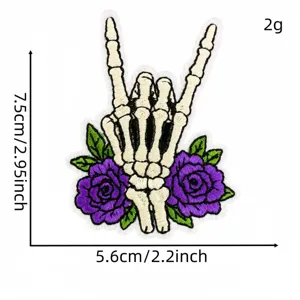 Skeleton hand rock sign and purple rose embroidered patch, detailed gothic style applique.