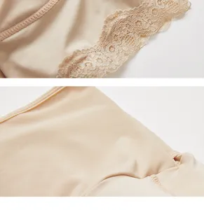 Close up detail of nude shapewear underwear featuring delicate lace trim and smooth breathable fabric.
