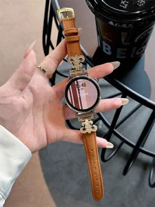 Metal leather smart watch strap replacement with luxury decorative charms and stylish brown band.