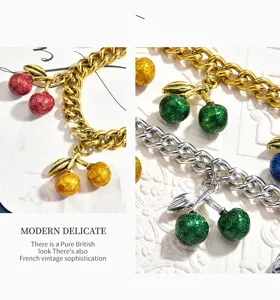 Sweet cool style multi-color cherry pendant metal chain bag charm with glitter finish.
