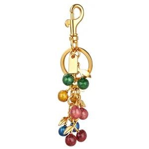 Colorful glitter cherry cluster keychain, cute metal leaf bag charm for women and girls.