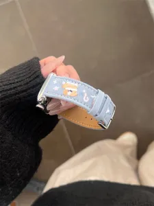 Denim watch band with cute puppy embroidery, compatible with Apple Watch, stylish accessory.