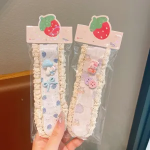 Cute lace fringe magic sticker detail showing sweet cartoon resin charms and delicate lace trim.