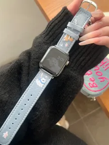 Denim embroidery watch band compatible with Apple Watch, cute puppy design, stylish accessory.
