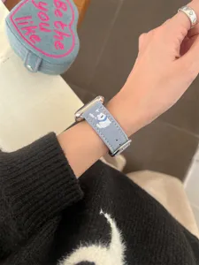 Denim embroidered dog watch strap detail view, compatible with Apple Watch, stylish wrist accessory.