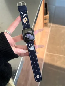 Detailed view of dark blue canvas watch strap with cute embroidered puppy and star patterns.