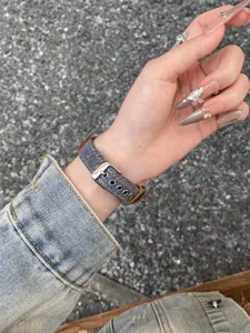 Canvas smartwatch replacement band with metal buckle and leather loops for daily wear wrist detail