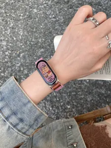 Close-up of smart watch band detail, pink canvas leather strap worn on wrist with cartoon view.