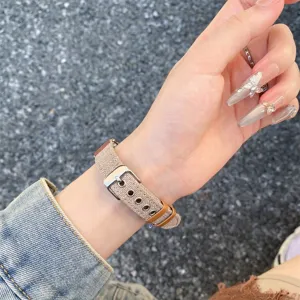 Canvas replacement watch strap with metal buckle, casual style worn on wrist for smart watches.