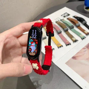 Detailed view of the red corduroy smart watch band with cute bear decoration and magnetic design.