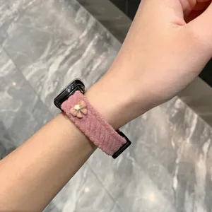 Pink corduroy smartwatch strap detail, cute bow design, soft texture, comfortable wear.