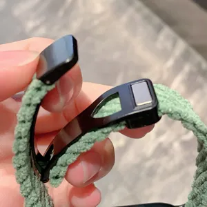 Green corduroy smartwatch replacement strap with a secure black magnetic metal buckle design.