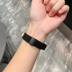 Black corduroy magnetic watch strap detail, comfortable fit for smart fitness band and watch.