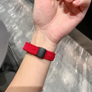 Red corduroy magnetic watch strap detail shot worn on wrist, soft, stylish and comfortable