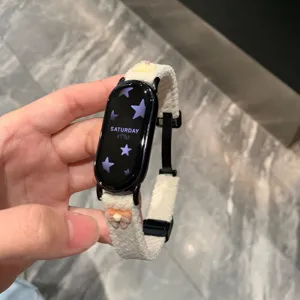 Corduroy magnetic watch strap with cute bow and bear decoration for smart watch replacement.