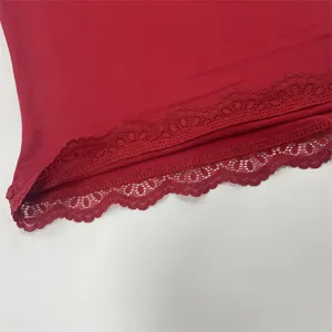 Red long sleeve top detail featuring delicate lace hem trim for women stylish daily wear.