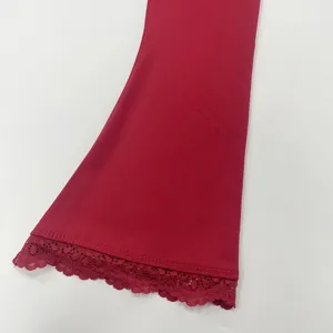 Red long sleeve top detail featuring elegant lace trim cuff, soft stretch fabric for autumn.