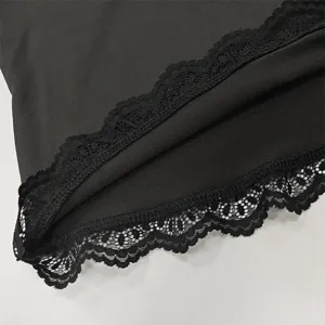 Black long sleeve top detail featuring elegant black lace trim design, soft and comfortable.