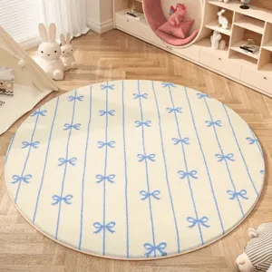 Cream style round plush rug with cute blue stripe and bow pattern for cozy bedroom decor.