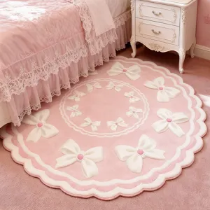 Pink round cashmere-feel rug detail, soft cute bow bedside mat for cozy bedroom decor.