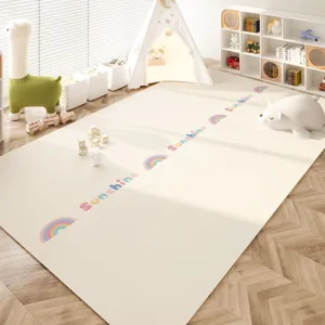 Detailed view of the waterproof PVC crawling mat with rainbow pattern in a cozy room setup.