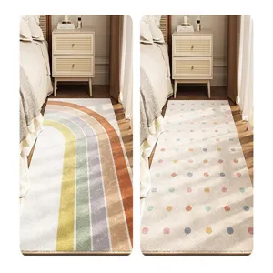 Detailed close-up showing the soft cashmere-like texture and vibrant patterns of the bedside rug.