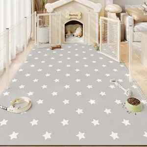 Detalle de alfombra para mascotas de PVC gris con estrellas y superficie impermeable