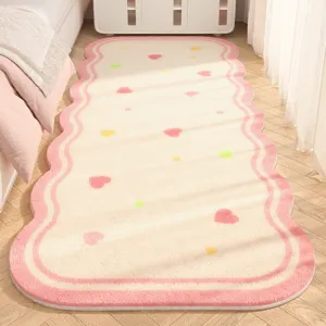 Soft imitation cashmere bedside rug detail, cozy pink wavy design for bedroom floor.