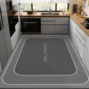 Kitchen floor mat detail, dark gray diatom mud anti-slip mat with white border and text.