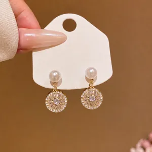 Exquisite zircon and pearl dangle earrings featuring 100% copper material for women.