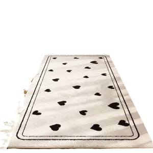 Cozy bedroom bedside rug with chic black heart pattern, soft and stylish home floor mat.