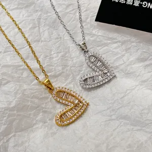 Detailed view of Korean style hollow heart cubic zirconia necklaces in gold and silver finishes.