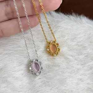 Detailed close-up of French cat's eye stone lace pendant necklace in silver and gold variants.