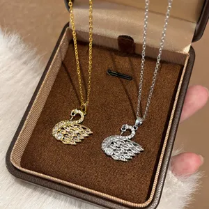 Elegant crystal swan pendant necklace set, gold and silver titanium steel fashion jewelry.