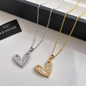 Detail shot of Korean style hollow heart rhinestone pendant choker necklaces in silver and gold.