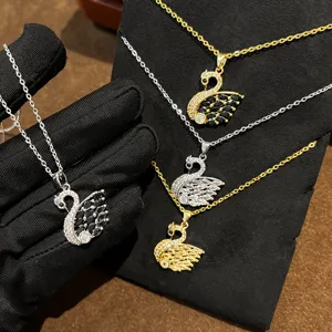 Exquisite swan pendant necklace detailed shot, featuring sparkling crystals and elegant charm.
