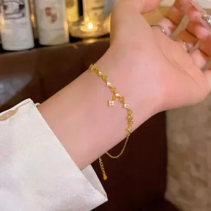 Exquisite Korean style zircon star bracelet detail, delicate gold chain with sparkling stones.