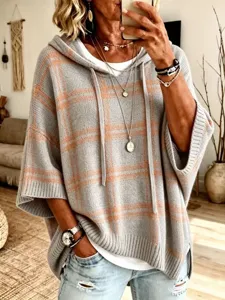 Casual grey orange plaid hooded knit poncho sweater, loose fit pullover winter outerwear piece.