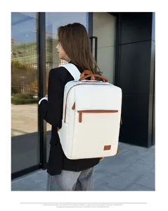 Stylish white business laptop backpack with brown leather trim for commuter and travel.