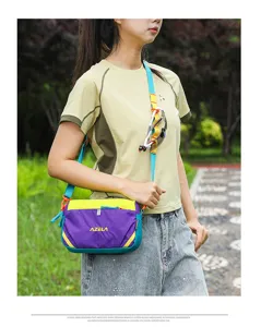 Outdoor detail shot of women casual colorblock nylon crossbody bag with strap sunglasses holder.