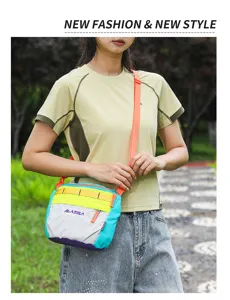 Detailed close-up of a colorful outdoor shoulder bag featuring a stylish color block design and strap.