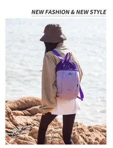 Lightweight folding backpack for outdoor travel, waterproof nylon daypack for women men.