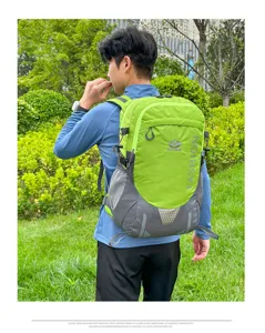Large capacity outdoor hiking backpack in green and grey, durable travel daypack for men.