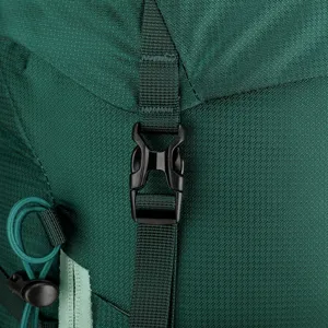 Detailed view of durable outdoor backpack buckle and adjustable green strap for hiking.