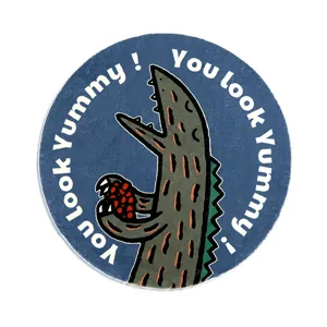 Rond vloerkleed met schattig dinosaurus motief, perfect detail voor de kinderkamer decoratie.